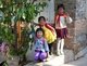China: School girls in the Old Town on their way home, Lijiang Old Town, Yunnan Province