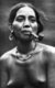 Philippines: Ifugao woman with arm and shoulder tattoos, smoking a pipe, Cordillera Administrative Region, Central Luzon, c. 1950